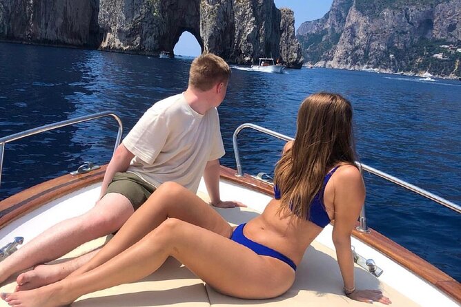 Boat Tour of the Caves on the Island of Capri - Faraglioni: the signature view and swim stop