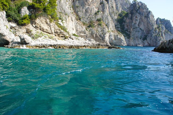 Capri & Blue Grotto Small Group Full-Day Boat Tour from Positano - Swimming, towels, and a glass of Prosecco