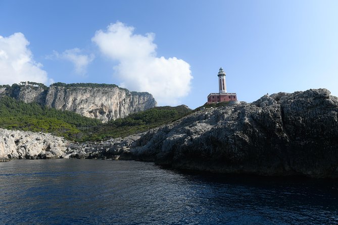 Capri Coast to Coast: Boat Tour with Optional Blue Grotto - Arches, villas and the Faraglioni