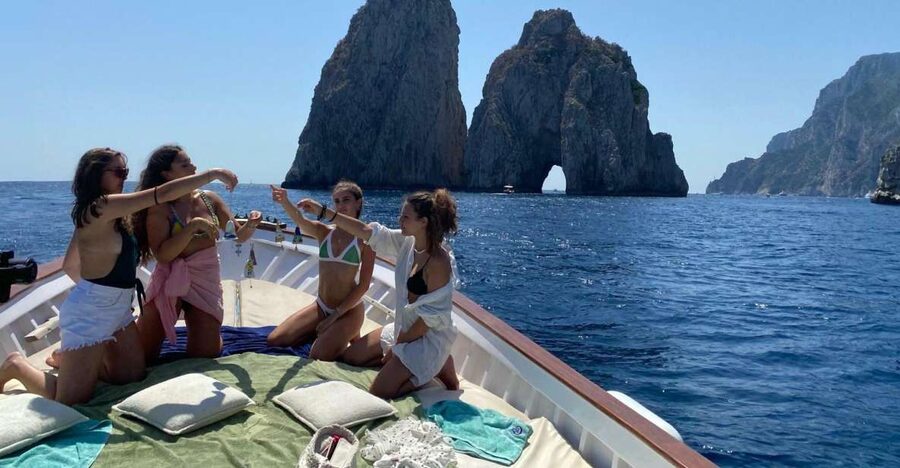Capri: Island and Grottos Boat Cruise with Snacks and Drinks - Leaving Marina Grande for the coastal caves