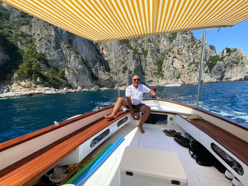 Capri: Island and Grottos Boat Cruise with Snacks and Drinks - Natural Arch, Casa Malaparte, and Punta Carena