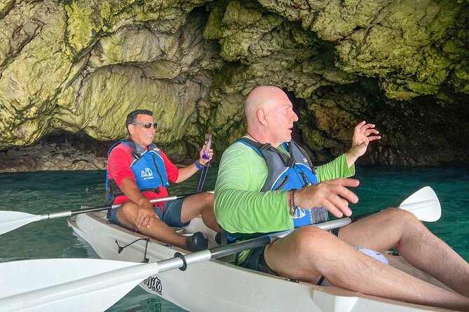 Kayak tour in Capri between caves and beaches. Photos included. - A swim in clear water, if you want one