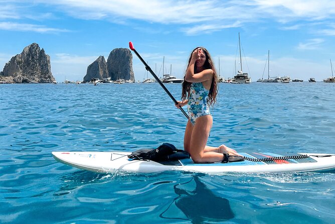 Paddleboard in Capri between caves and beaches. Photos included! - Faraglioni photos and a swim stop