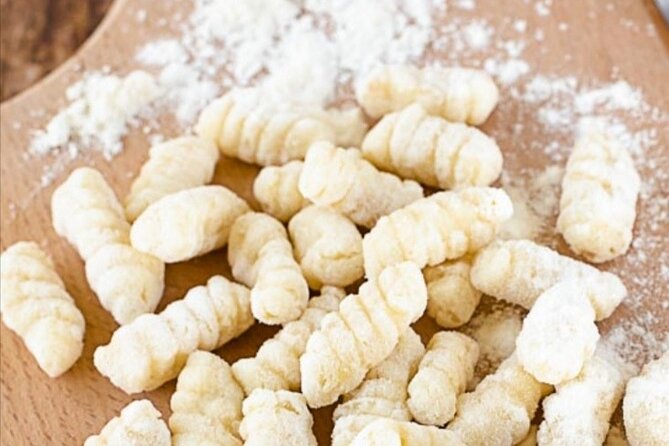Small-Group Cooking Class in Positano: Gnocchi, Tiramisù & Drinks - A family table with more than pasta